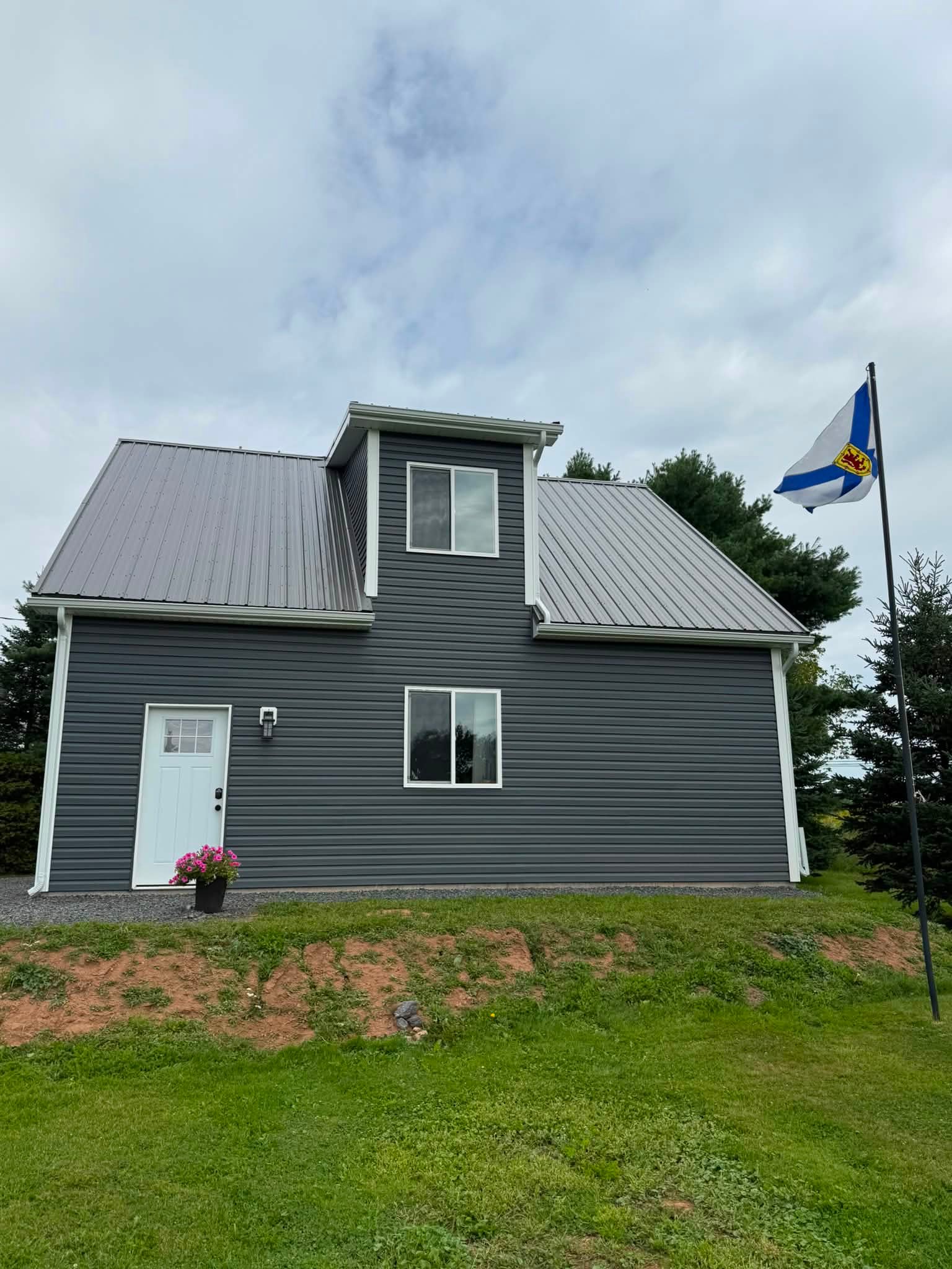 Completed garage with metal roof siding soffit fascia and eavestrough